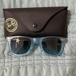 Ray-Ban Wayfarer baby blue sunglasses.